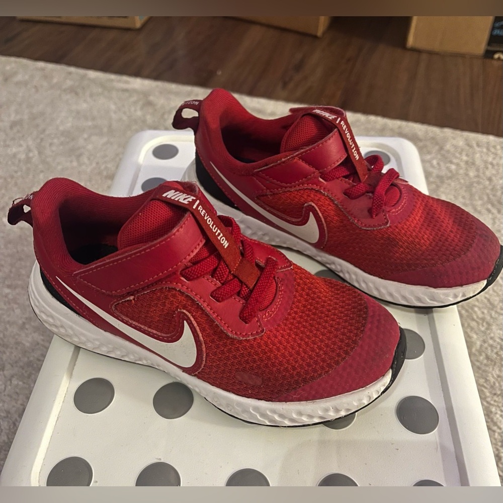 Kids Red Nike running shoes size 12